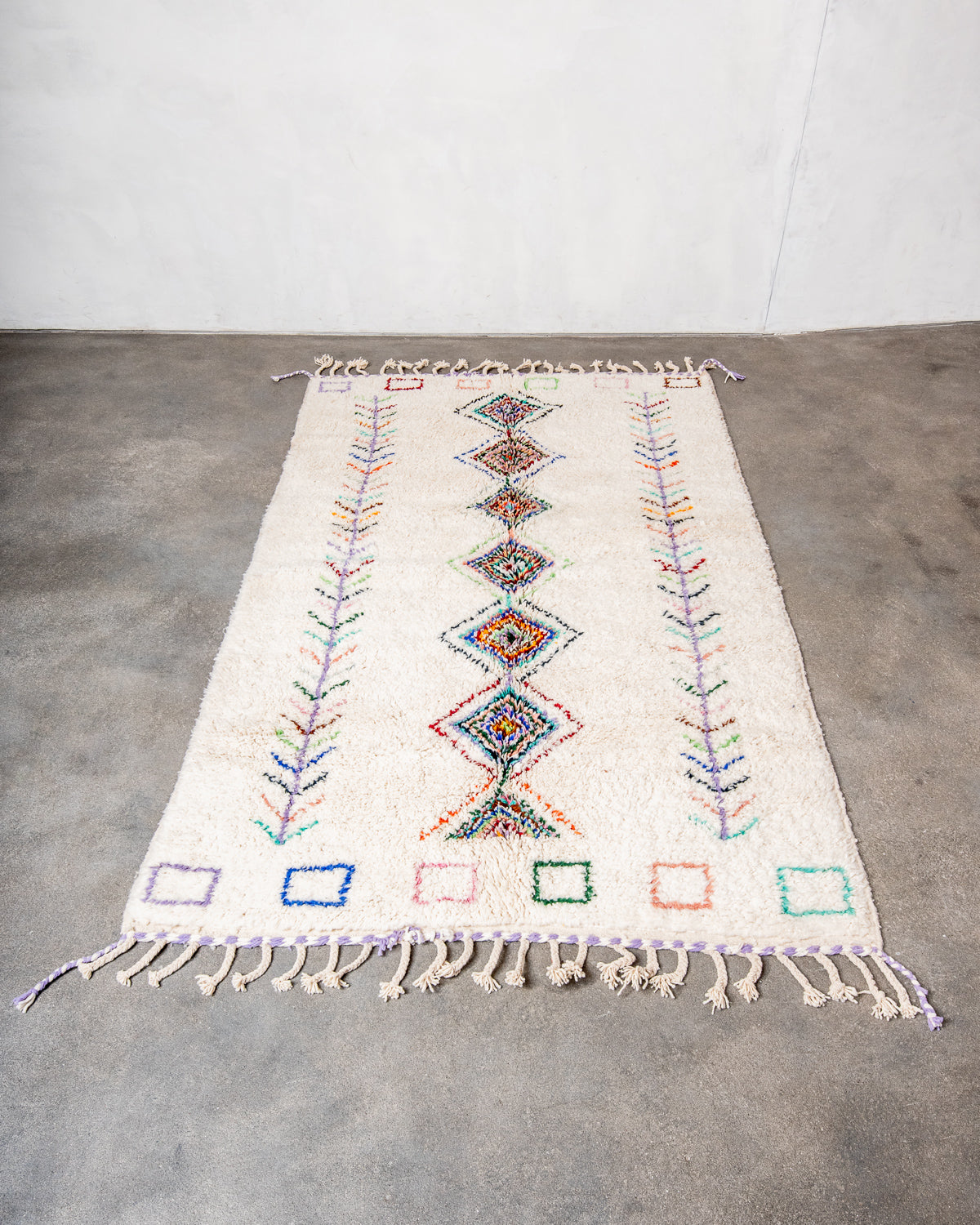 Modern, designer, handcrafted Berber rug from Morocco. Beniourain carpet with beautiful colours and patterns and fluffy wool texture.